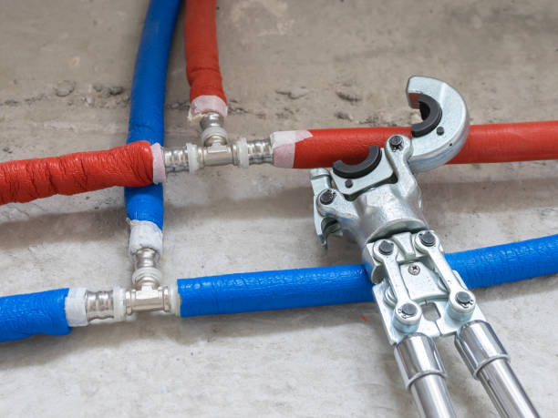 Plumbing copper pipe crimper press tube tool. Heating pipes connected by press fittings. Hydraulic, tools for plumber.
