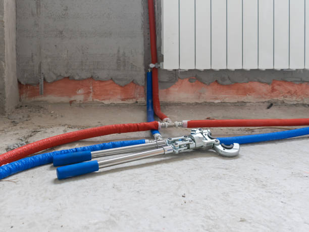 istock Plumbing copper pipe crimper press tube tool. Heating pipes connected by press fittings. Hydraulic, tools for plumber. 1201876586