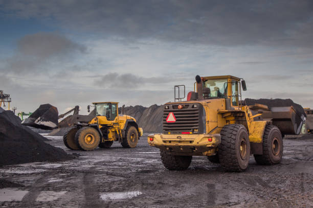 istock A bucket loader carries out loading of coal in an open port warehouse on a background of black mountains of coal 1201877132