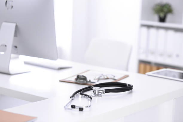 istock Stethoscope, prescription medical form lying on a table with pc computer. Medicine or pharmacy concept. Medical tools at doctor working table 1201878493