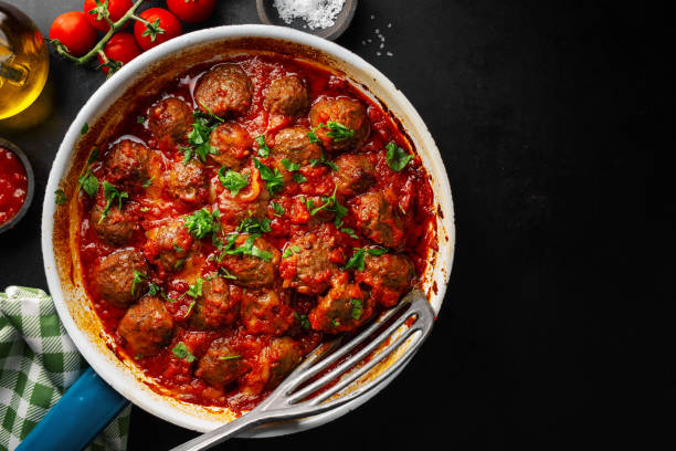 istock Fried meatballs with sauce on pan 1201880123
