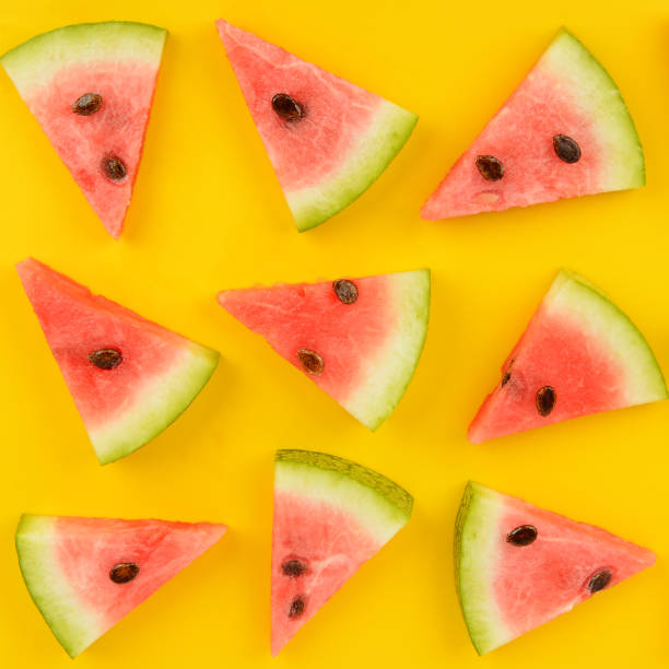istock Sliced ripe juicy watermelon on a bright yellow background. 1201881583