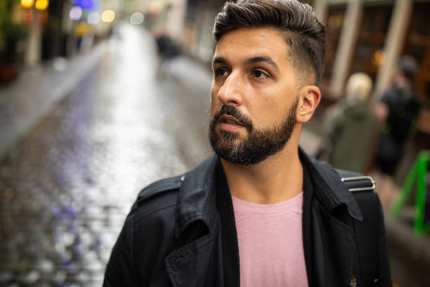 istock Well dressed man walking down pedestrian street 1201881990