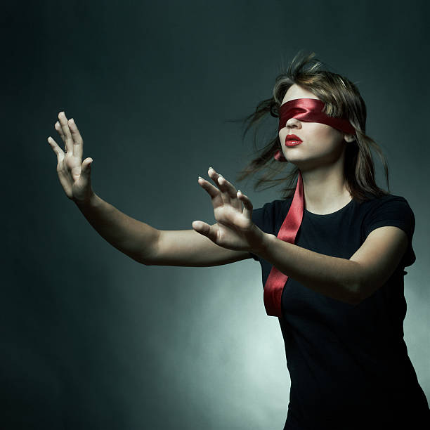 Woman blindfolded, smiling - Stock Image - F003/3209 - Science Photo Library