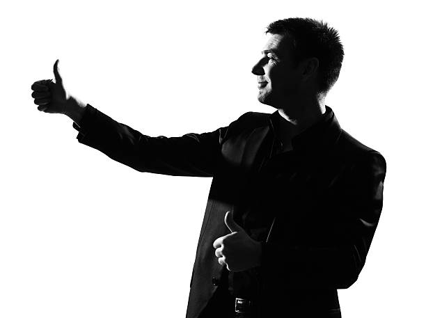 istock silhouette  man  winner thumbs up 120188559