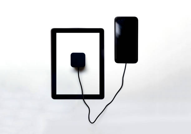 istock Sharing battery and power between devices, charging from device to device concept to extend battery life on smart phone 1201886566