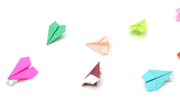 istock Colorful origami planes on white 1201890435