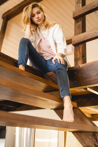 istock Attractive blonde woman having rest at home 1201891182