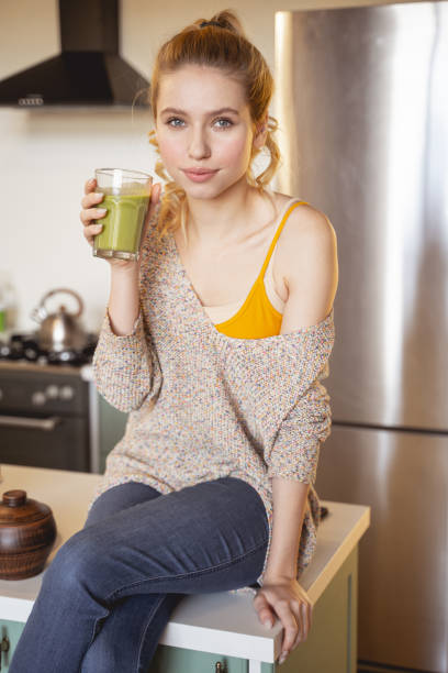 istock Attractive young female looking straight at camera 1201891738