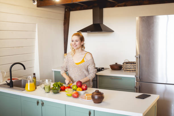 istock Positive delighted blonde woman doing fresh salad 1201892027