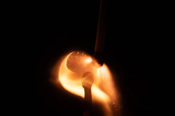 istock Ignition of match with sparks isolated on black background space for text fire concept passion figures variety 1201892209