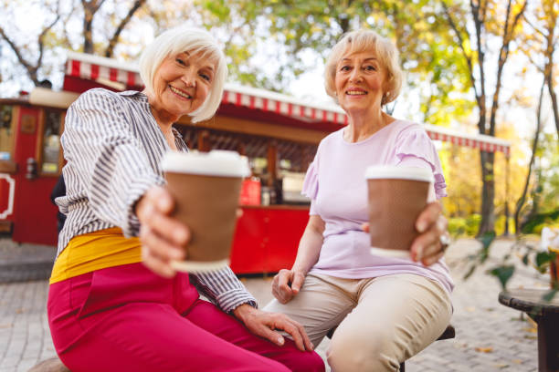 istock Happy friends having a coffee break together 1201892416