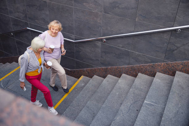 istock Old friends going out the subway together 1201892519