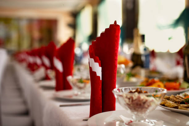 istock Red napkin on the festive table with a white tablecloth. 1201898136