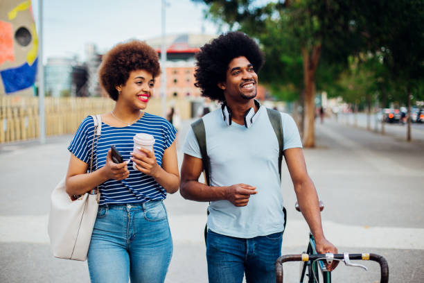 istock Two colleagues go to work together and flirting 1201898439
