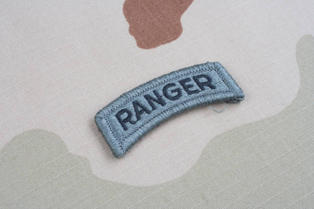 istock US ARMY ranger tab on camouflage uniform 1201899224