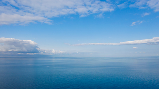 Aerial view of endless sea and blue sky.