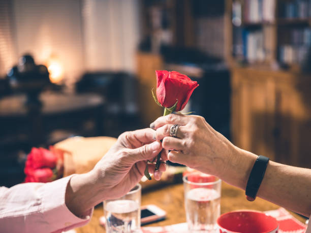 istock Hands of Senior couple at Valentines Dinner 1201902144