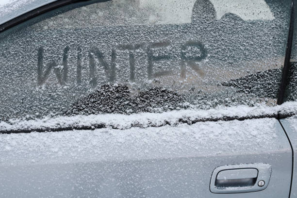 istock Winter in traffic. A car with snow and ice 1201902189