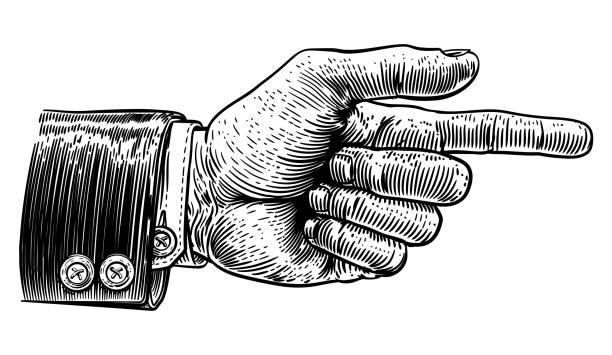 Hand Pointing Finger Direction In Business Suit A hand pointing a finger in a direction sign. Wearing a business suit in a vintage antique engraving woodblock or woodcut style. aiming illustrations stock illustrations