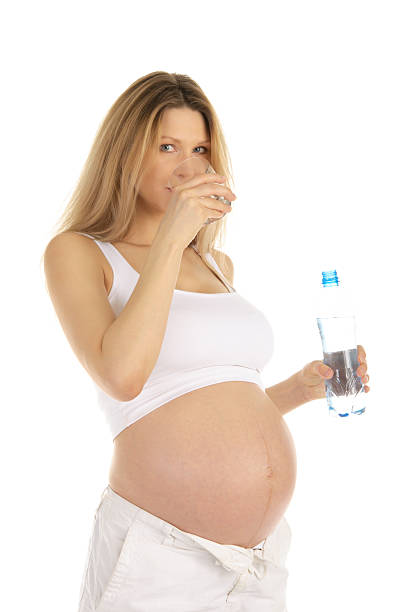 istock pregnant woman drinks water 120190503