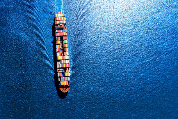 Fully Loaded Container Ship A fully loaded container ship heading toward the Port of Houston from the Gulf of Mexico. maritime container stock pictures, royalty-free photos & images