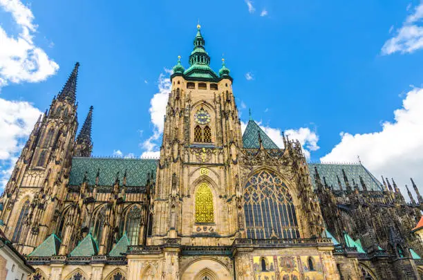 Golden Gate South Tower with clock - exterior of St. Vitus Cathedral or The Metropolitan Roman Catholic Cathedral in Prague Castle Hradcany Lesser Town district, Bohemia, Czech Republic