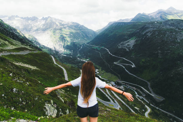 istock Young woman exploring the Switzerland mountains during summertime 1201905956
