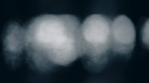 istock Light blurry spots on a dark background in blue tonality. 1201908084