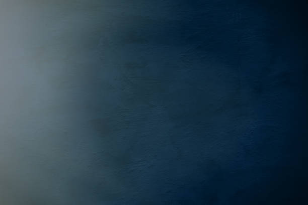 istock Cement plaster wall in a dark blue tone. 1201908091