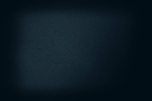 istock Abstract grainy background in a dark frame, blue tonality. 1201908127
