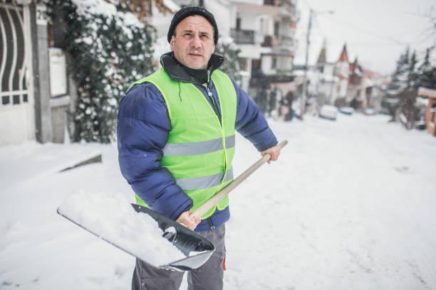 istock man with snow shovel, winter weather 1201911037