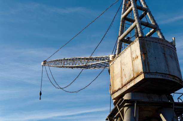 Historic crane in front of blue sky