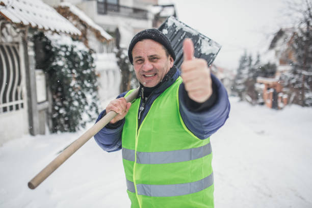 istock man with snow shovel, winter weather 1201911070