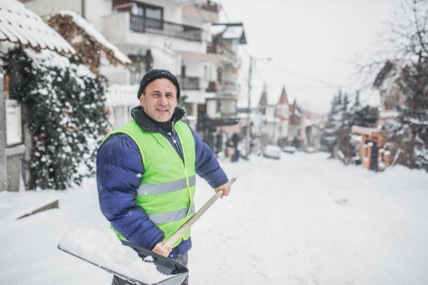 istock man with snow shovel, winter weather 1201911108