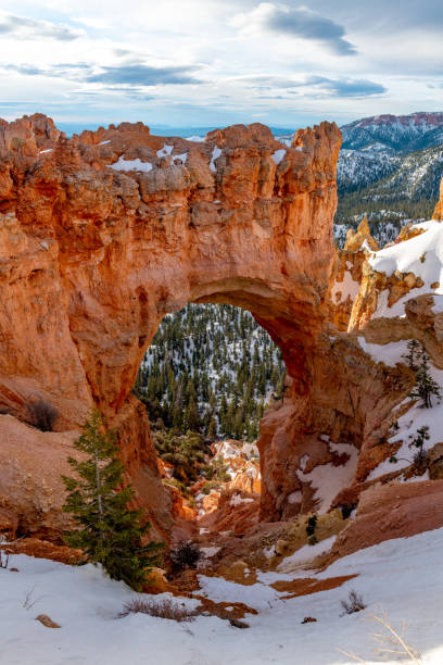 istock Hole in a rock cliff forming an arch Bryce Canyon Utah 1201911339