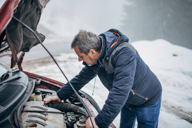 istock Car breakdown in winter in a snowstorm 1201916185