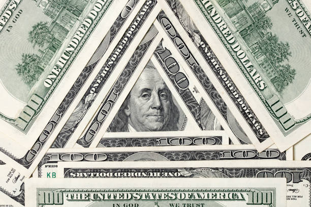 istock Triangle made of $100 bills with Benjamin Franklin inside 1201917722