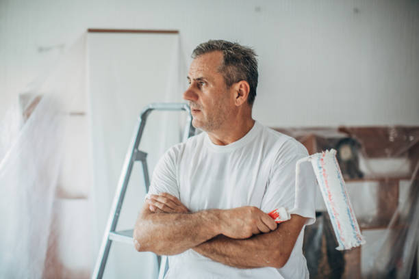 istock The painter makes a plan for the decoration of the apartment 1201921598