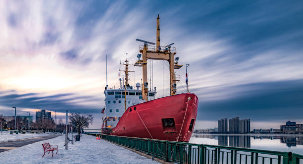 The Windsor, Ontario skyline with a Coast Guard ship moored along its waterfront.