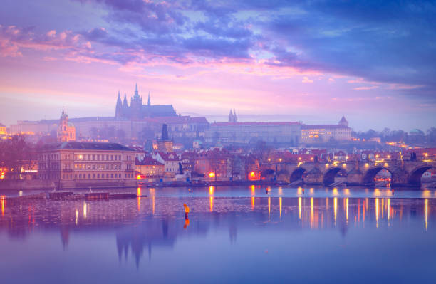View from Charles Bridge on Prague old town with waterfront, cathedral and castle.