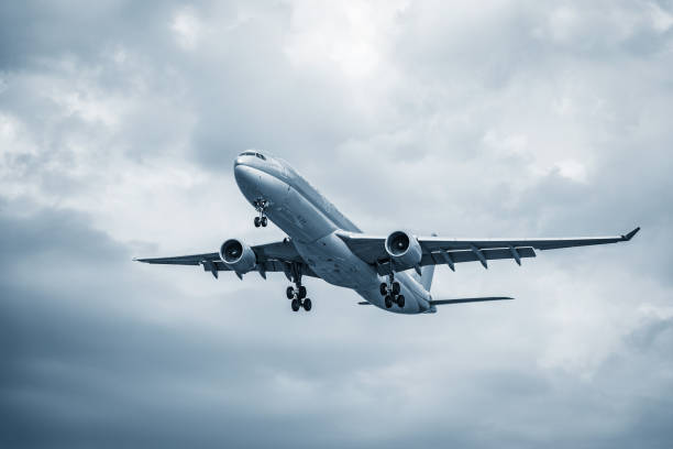 Flight of the passenger plane above the clouds.