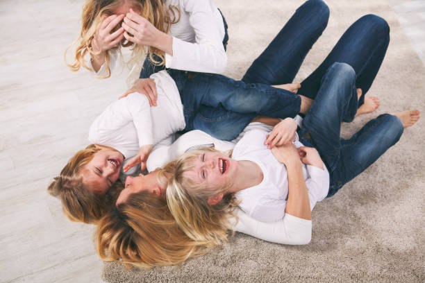 istock Single mother playing with her three children 1201933036