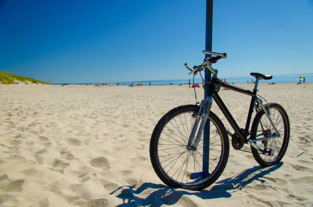 istock Bicycle on sandy yellow beach, Curonian Spit, Baltic sea, Lithuania 1201937123