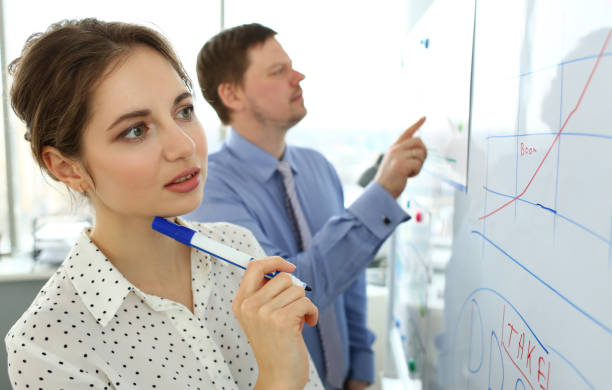 istock Smiling beautiful woman in office telling something important 1201937157