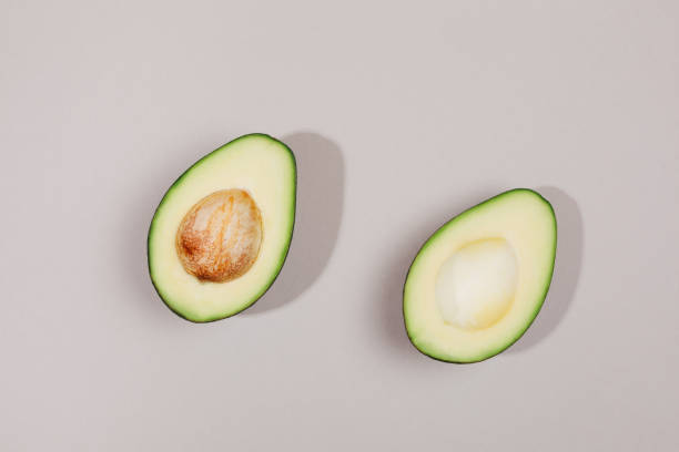 istock Two parts of avocado. 1201937805