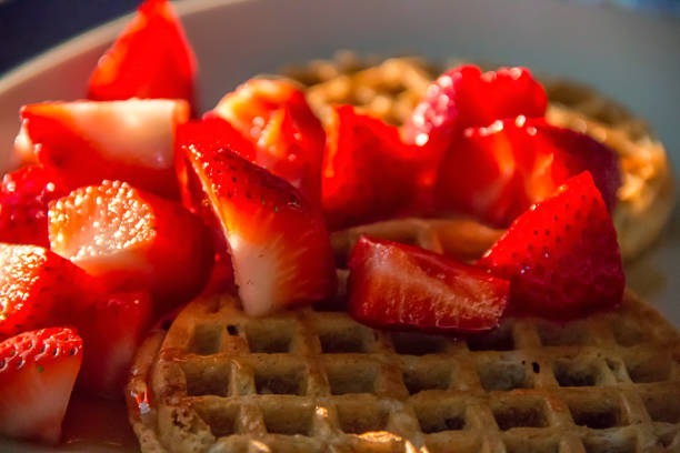 istock Fresh strawberries on a waffle for breakfast 1201939506