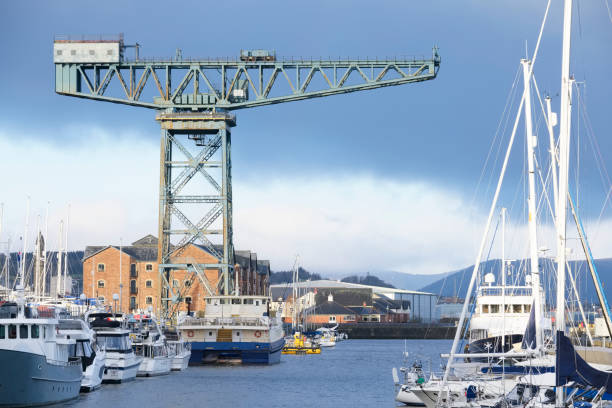 Cantilever lifting vintage crane for shipbuilding in Greenock near Glasgow and freight container transportation Cantilever lifting vintage crane for shipbuilding in Greenock near Glasgow and freight container transportation uk clyde river stock pictures, royalty-free photos & images