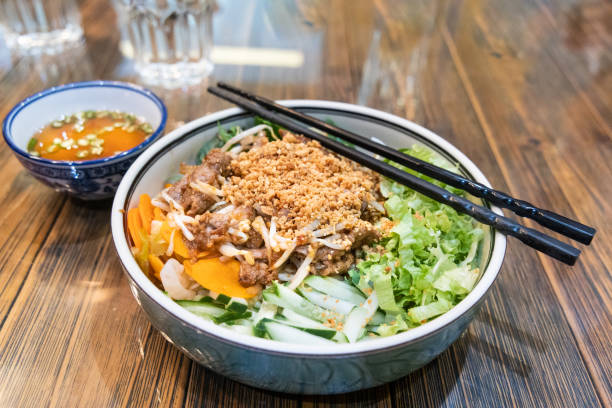 istock Vietnamese stir fried beef with vermicelli and various vegetable 1201968829