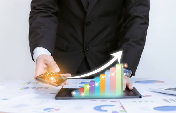 istock Business analyze graphs with the technology development pointing graph corporate to success and growing plan concept 1201975785